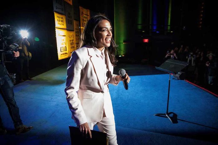 Woman in a light suit holding a microphone on stage