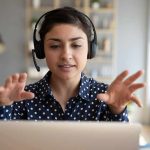 Woman wearing headset on video call
