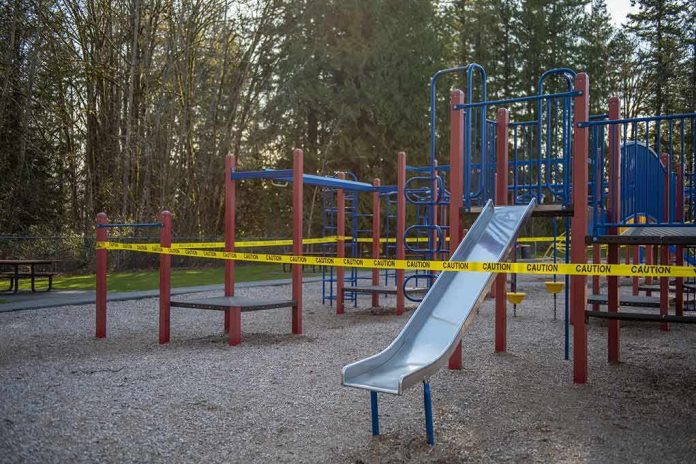 shutterstock_1699954372 Playground equipment wrapped with caution tape