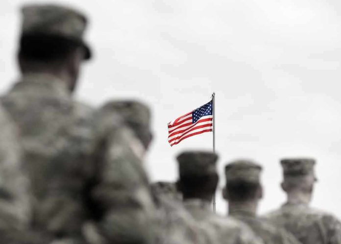 American flag above blurred soldiers in formation