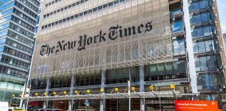 New York Times building with yellow taxis in front