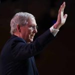 McConnell Returns, Then Detonates D.C. older man in suit raising his hand