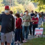 Christian Jones and others waiting in a long line outside a polling place