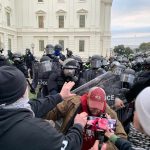 Governor Dares Troops – Disobey Unlawful Orders Dontrelle Inman among protesters and police in riot gear outside a government building
