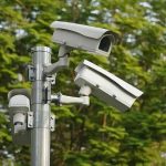 surveillance cameras mounted on a metal pole