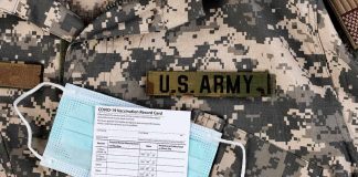 U.S. Army uniform with face mask and vaccination card
