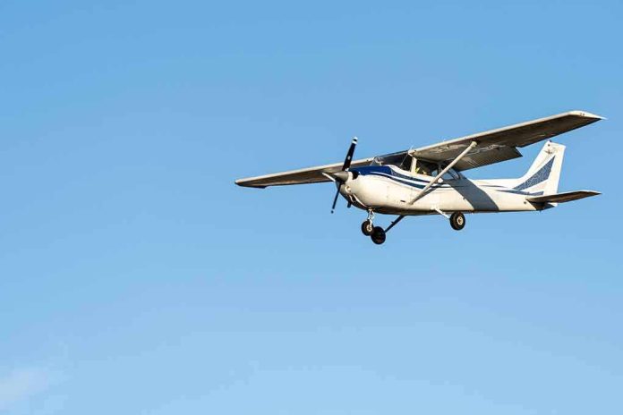 Single-engine airplane flying against clear blue sky