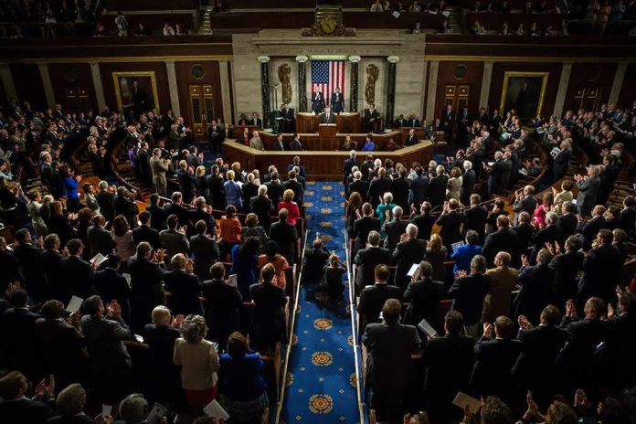 shutterstock_218485888 Legislative chamber audience stands and applauds