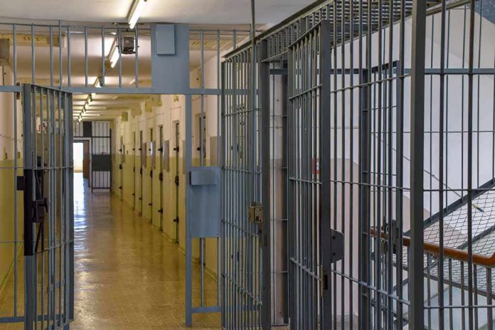Prison corridor with barred doors
