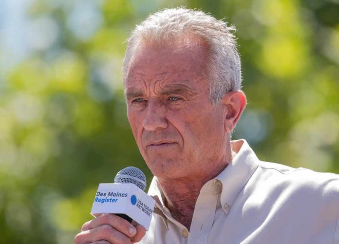 shutterstock_2346739537 Man speaking into a microphone outdoors