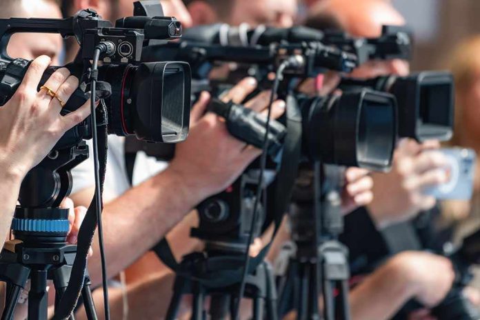shutterstock_2692761619-4 television cameras on tripods at a media event