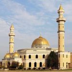 Trump Judge Frees Hamas-Linked Prisoner! Mosque with golden dome and two tall minarets under a partly cloudy sky