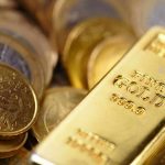Gold bar and coins close-up