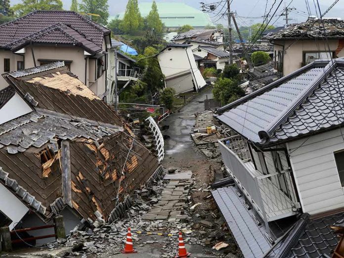 Earthquake-damaged residential street with collapsed houses