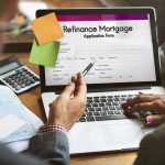 Laptop displaying refinance mortgage application form
