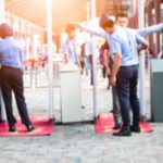 Foreigners Responsible For 87% Of Public Transport Violence Security officers screen people at walk-through metal detectors
