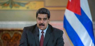 U.S. Indicts Maduro: Americans Tortured Nicolás Maduro speaking at a podium with a microphone