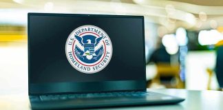 Trump’s Metal Detector Ultimatum Laptop displaying U.S. Department of Homeland Security logo.