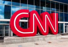 CNN Icon Walks After 43 Years CNN red logo sculpture outside a modern glass building