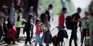 Hundreds of Child Marriages Reported in Migrant Communities People with bags walking along railway tracks