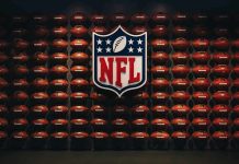Anthem Lyrics DISGRACE Rocks NFL NFL shield logo over wall of footballs