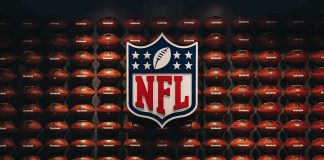 Anthem Lyrics DISGRACE Rocks NFL NFL shield logo over wall of footballs