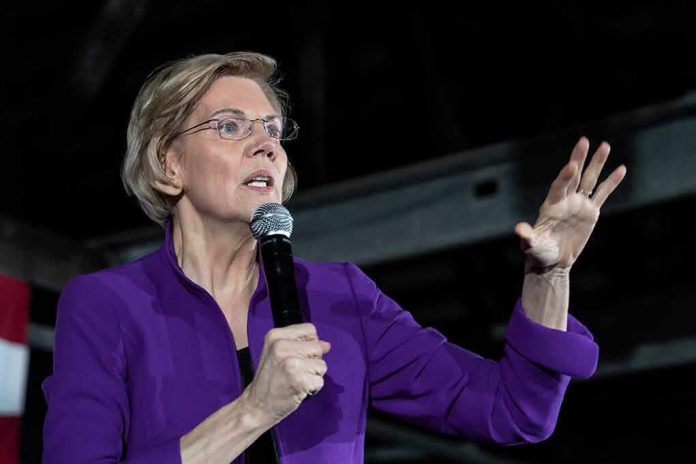 woman in purple jacket speaking into a microphone