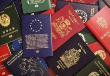 Assorted international passports spread out on a surface