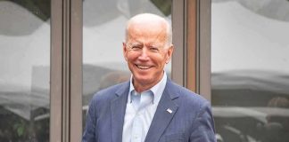 Biden’s Final Humiliation – Library Cash Empty smiling older man in a blue suit standing outdoors