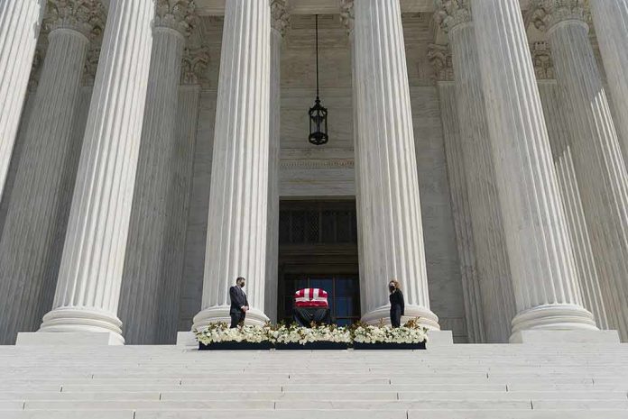 shutterstock_1820477594 Flag-draped casket on courthouse steps between towering columns