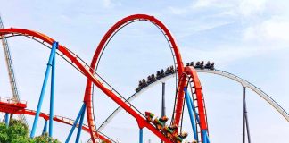 Man FLUNG From Seat – Horror At Six Flags Colorful roller coaster with riders on a sunny day