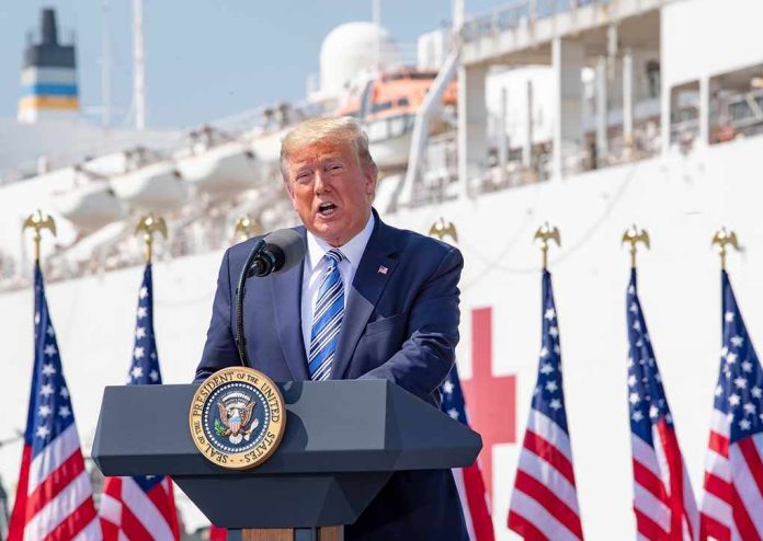 Donald Trump speaking at a podium with American flags and a ship in the background