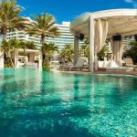 Resort Horror: Mom Stabs Husband, Toddler to Death Resort pool with cabana and palm trees