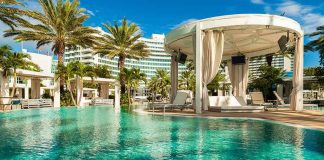 Resort Horror: Mom Stabs Husband, Toddler to Death Resort pool with cabana and palm trees