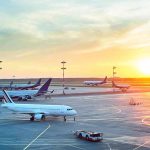 Airport Attack Sparks Trump Thunder Airplanes on airport tarmac at sunset
