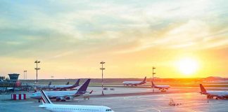 Airport Attack Sparks Trump Thunder Airplanes on airport tarmac at sunset