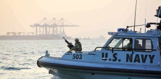 Gulf Flashpoint: U.S Drops Missile on Iran Ship U.S. Navy patrol boat with armed crew on the water