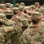 TRUMP Greenlights First Military Execution in 60 Years Soldiers in camouflage uniforms salute in formation